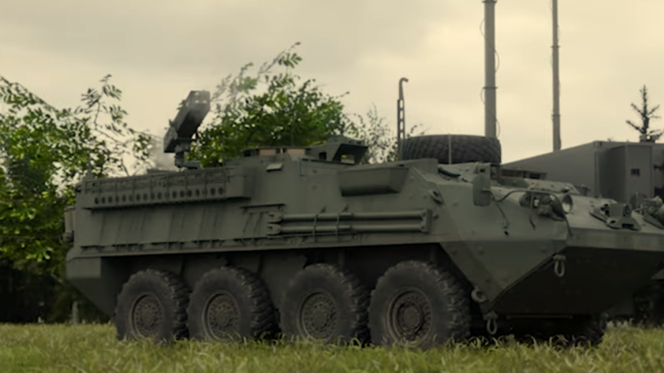 Armored military vehicle equipped with counter-UAS system and radar sensors in field environment