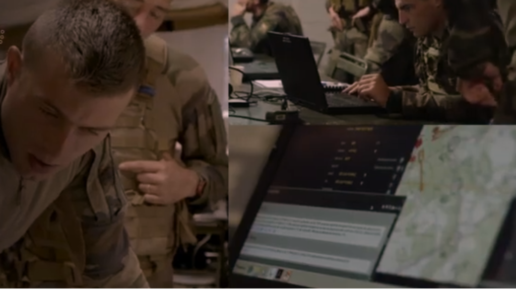 Military personnel using laptops and digital maps in a command center for real-time battle management.