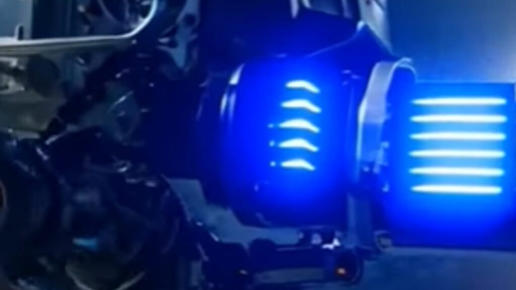 An advanced electronic warfare payload emitting horizontal blue light slits from its housing, demonstrating operational hardware for AI Call for Fire Automation.