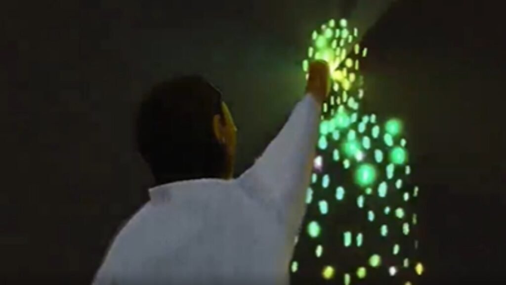 A man reaching out to interact with a human silhouette made of glowing green binary code, illustrating the concept of AI Cognitive Psychological Operations.