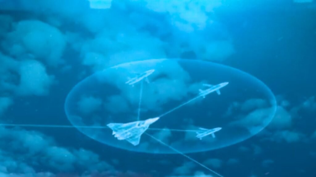 A stealth fighter jet commanding a squadron of drone loyal wingmen inside an illuminated bubble network, representing an AI combat cloud system.