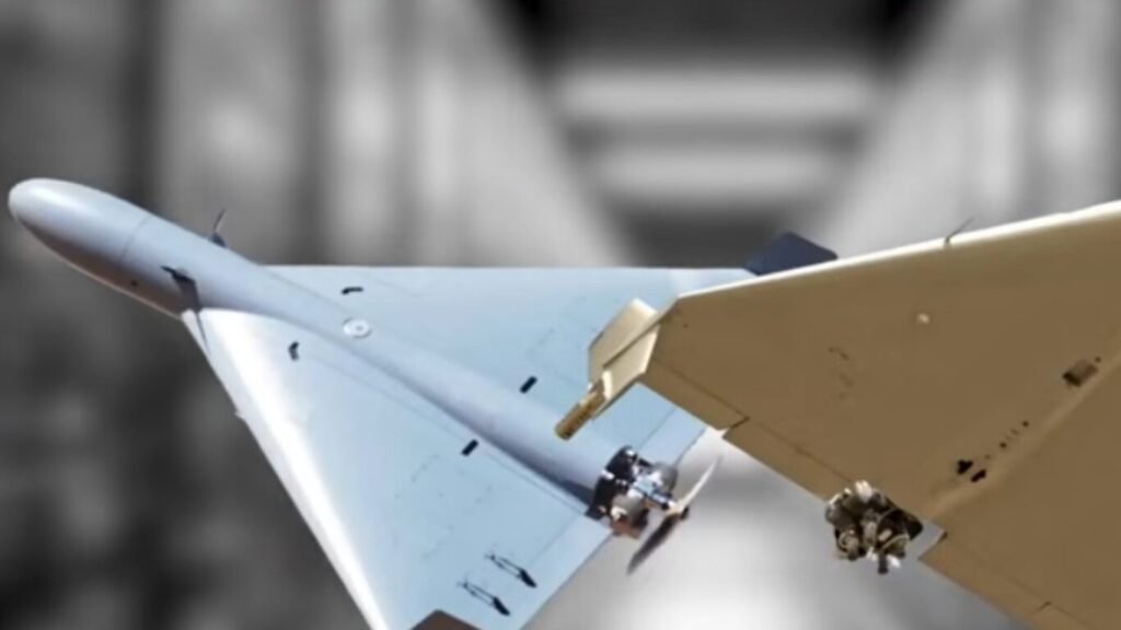 Two military delta-wing loitering munitions or drones positioned closely together against a blurred grey backdrop, demonstrating unmanned systems utilized in AI Defence Operations.