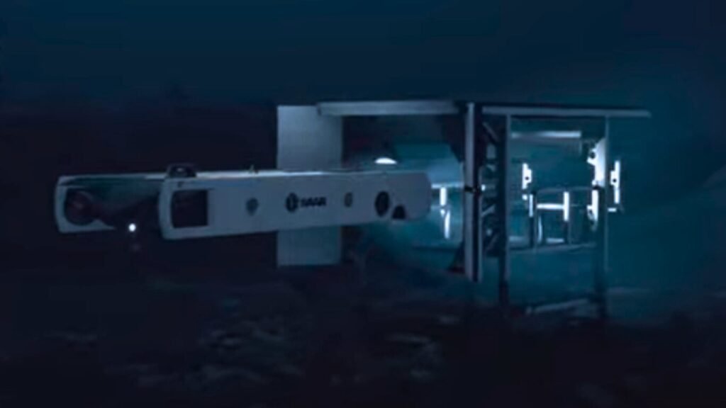 A white Sabertooth autonomous underwater vehicle exiting a subsea docking station, showcasing AI Powered Unmanned Underwater Vehicles performing deep-sea operations.
