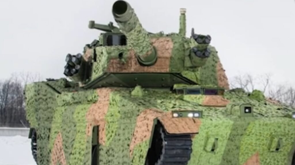 An armored combat vehicle wrapped in textured green and brown camouflage netting parked in the snow, representing heavy hardware for Autonomous Tank Platoons.
