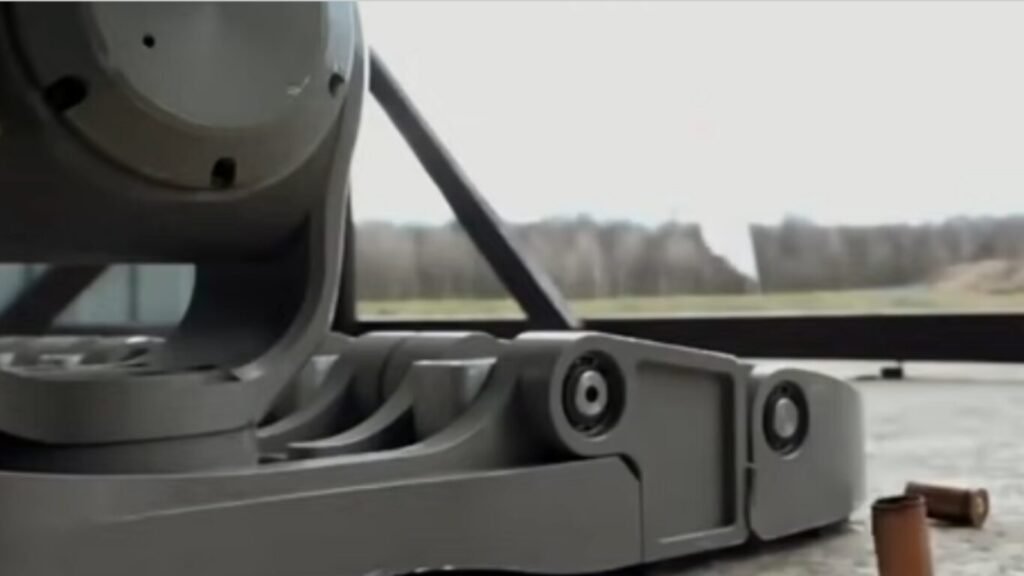 The automated robotic base and mechanical articulation joints of an unmanned weapon system deployed outdoors, illustrating hardware at the center of discussions on the Ethics of Lethal Autonomous Weapons.