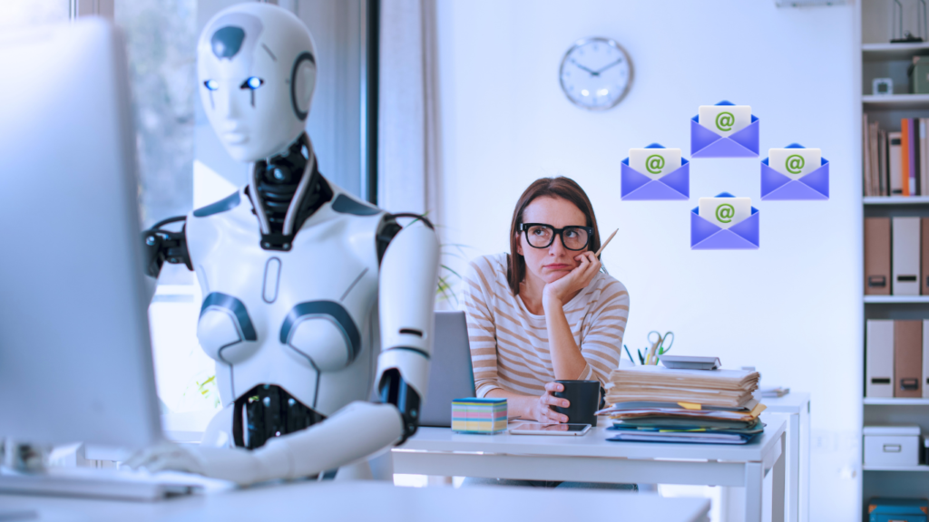 A futuristic office workspace scene highlighting the role of AI Email Agents, featuring a sleek white humanoid robot typing at a desktop computer in the foreground, while a human female coworker sits behind it looking thoughtful, underneath four floating blue envelope icons with green at symbols.