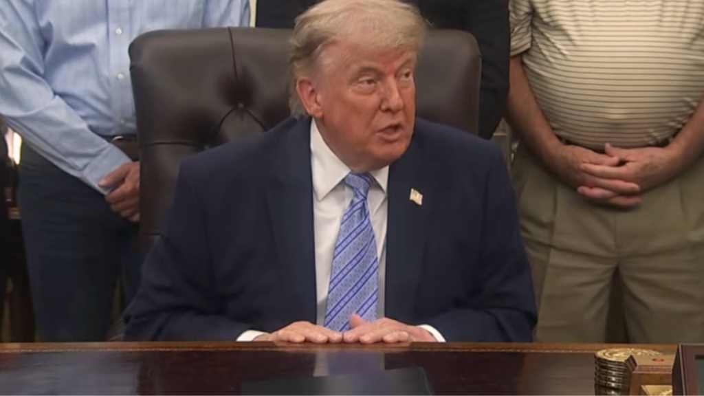 Trump AI executive order discussion featuring Donald Trump seated at the White House conference table during an official policy meeting on artificial intelligence regulation and technology governance.