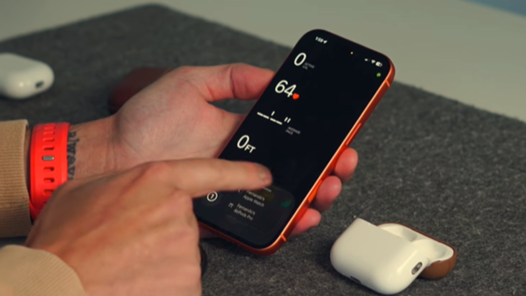 A person interacts with an iPhone screen displaying fitness metrics, showcasing integrated Apple Intelligence ecosystem features next to AirPods.