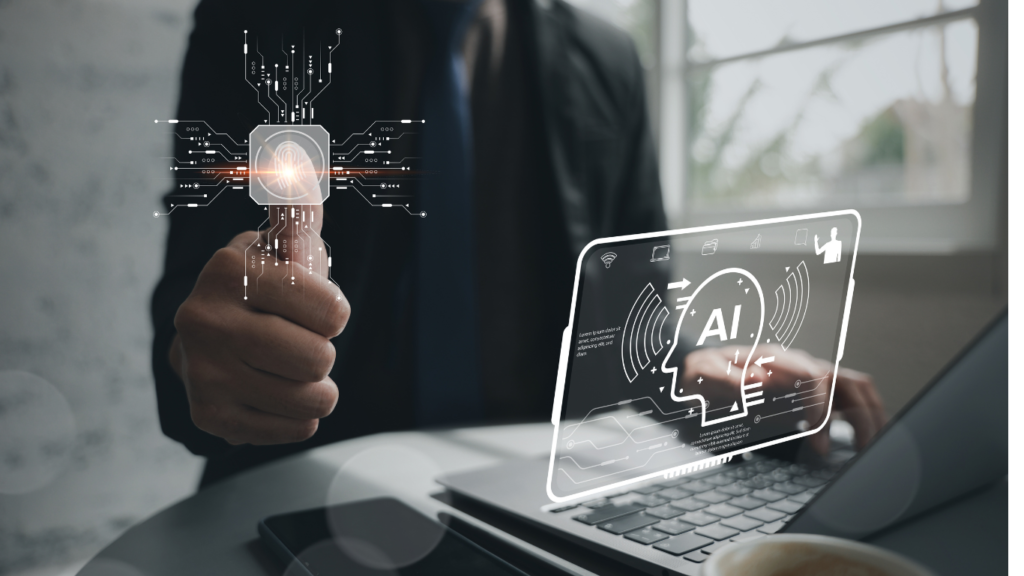 A businessman giving a thumbs-up next to a laptop displaying a glowing, transparent AI head icon, demonstrating how Edge AI Hardware for Enterprise Applications securely verifies biometric data and processes information locally.